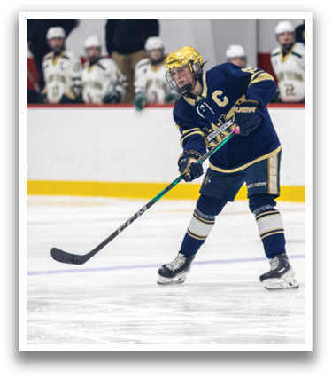 A hockey player in a blue and gold uniform is holding a hockey stick and preparing to shoot the puck. AI generated content