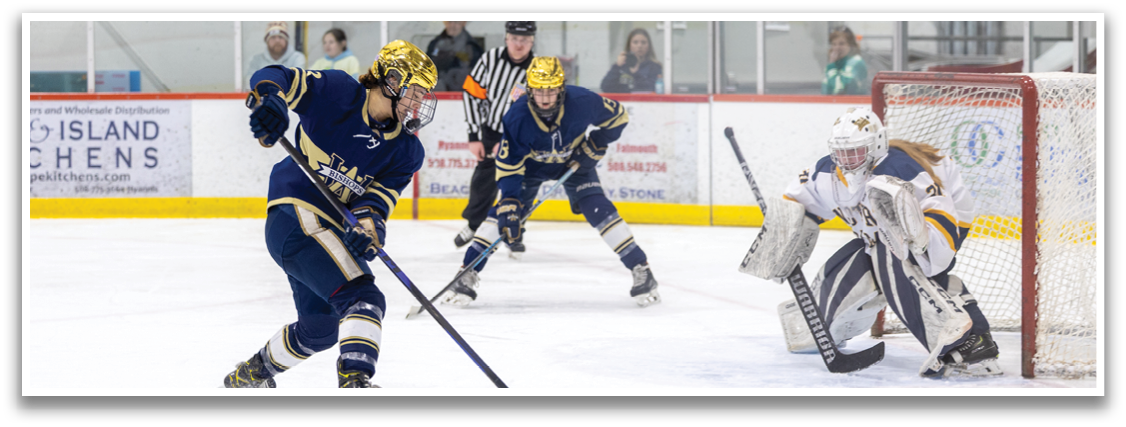 A hockey game is in progress with players on the ice. A goalie is in position, ready to catch the puck. A player is about to shoot the puck, while another player is holding a stick. The game is being watched by a crowd of spectators. AI generated content