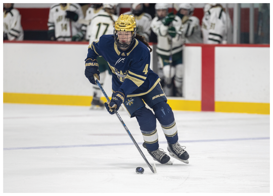 A hockey player in a blue uniform is skating on the ice. AI generated content