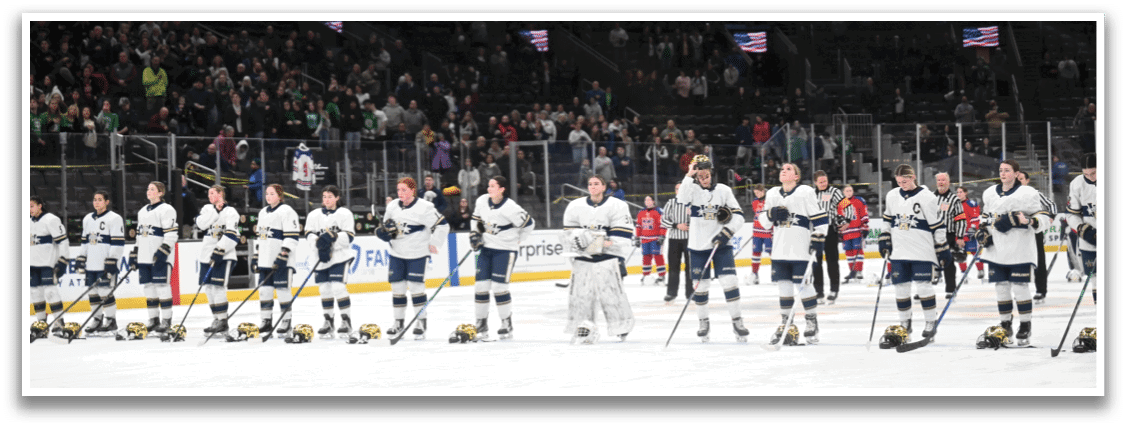 A group of hockey players are lined up on the ice, holding their hockey sticks. AI generated content