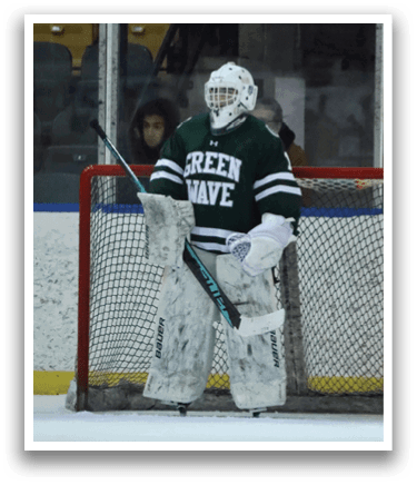 A hockey goalie wearing a green jersey and white pads stands in front of a net. AI generated content