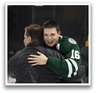 Two men hugging on ice, one wearing a green and white jersey. AI generated content