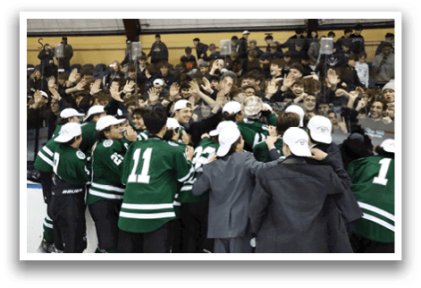 A group of hockey players huddle together on the ice, celebrating a victory. AI generated content