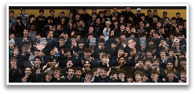 A group of people are sitting in a stadium, watching a game. They are wearing black shirts and are engaged in the event. AI generated content