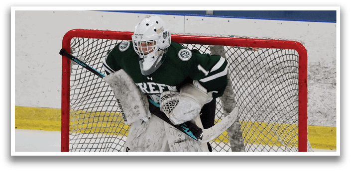 A hockey player in a green and white uniform is in position behind a net. AI generated content