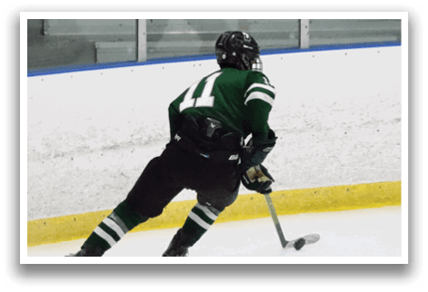 A hockey player in a green jersey is skating on the ice with a hockey stick. AI generated content