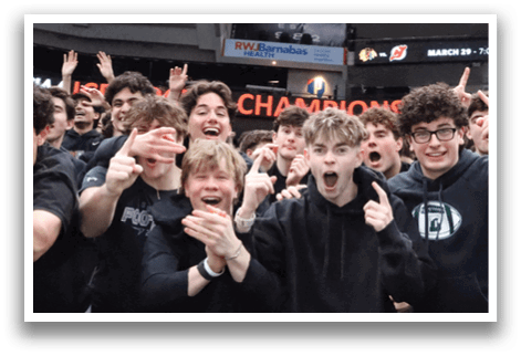 A group of young people are sitting in the stands of a sports arena, watching a game. They are wearing black clothing and are excited about the event. AI generated content