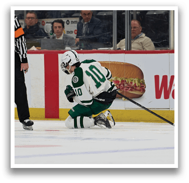 A hockey player is on the ice, holding a stick. AI generated content