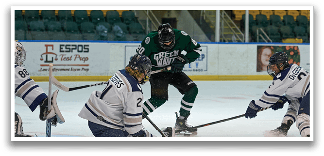 A hockey game is taking place with players on the ice. A man is skating with a hockey stick, while another player is kneeling on the ice. There are several other players on the ice, some of them wearing green and white uniforms. The scene is set in a stadium with a crowd of spectators watching the game. AI generated content