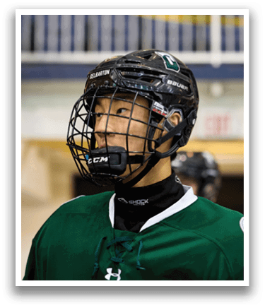 A hockey player wearing a green jersey and helmet. AI generated content