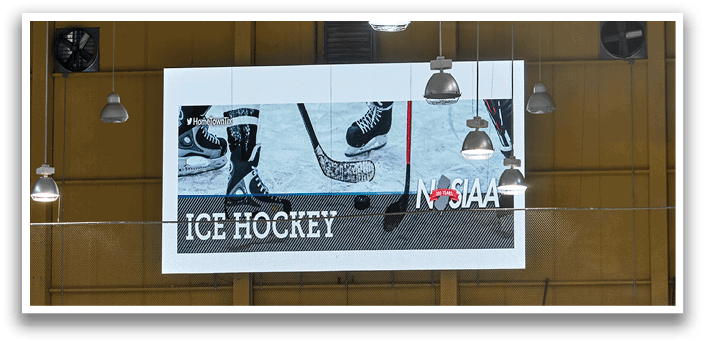 A scoreboard in a sports arena shows a hockey game in progress. AI generated content