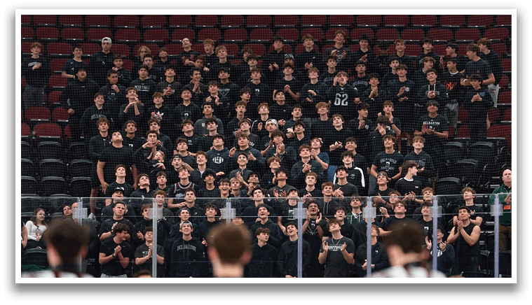 A group of hockey players are on the ice, with some standing in the center and others on the sides. They are all wearing black and white uniforms. AI generated content