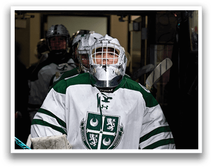 A hockey player wearing a white and green uniform holds a hockey stick. AI generated content