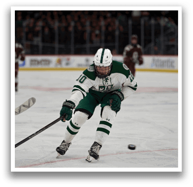 A hockey player in a green and white uniform is skating on the ice with a hockey stick. AI generated content