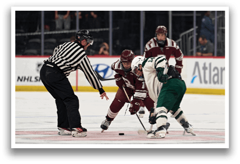 Three hockey players are on the ice, with one player in the middle holding a stick. The referee is standing behind them, watching the play. AI generated content