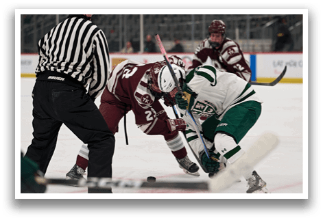 Two hockey players are fighting for control of the puck. AI generated content