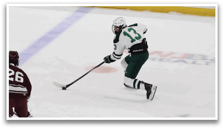 A hockey player in a green and white uniform is skating on the ice with a hockey stick. AI generated content