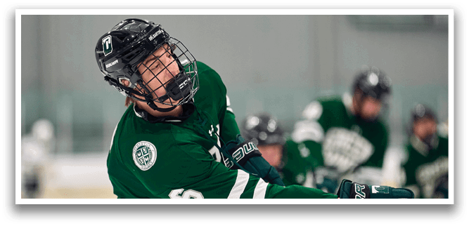 A hockey player wearing a green jersey with the number 6 on it is holding a hockey stick and looking up. AI generated content