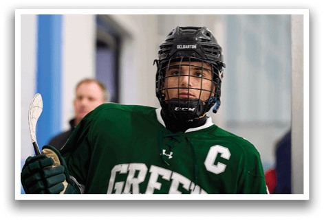 A hockey player wearing a green and white uniform with the number 17 on the back. AI generated content