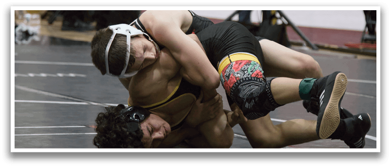 Two men are wrestling on a court, one of them is wearing a headband. AI generated content