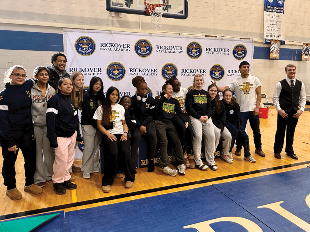 A group of people are posing for a picture in front of a basketball hoop. AI generated content