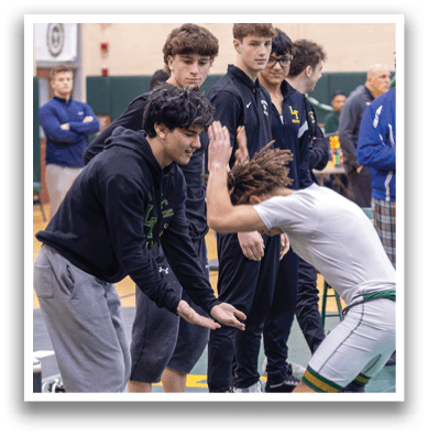 A group of people are gathered around a wrestler who is kneeling on the ground. AI generated content