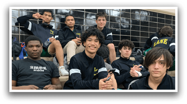 A group of young men wearing black shirts and green shorts are sitting on a bench. AI generated content