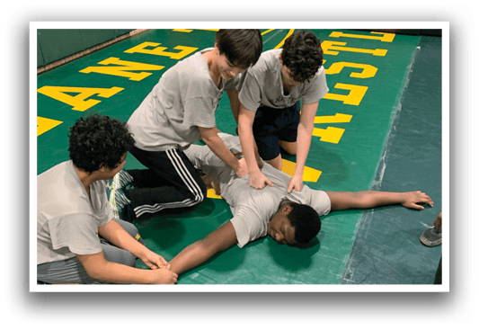 Three men are helping a fourth man who is lying on the ground. AI generated content