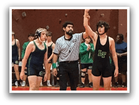 A referee is holding up a hand in a wrestling match, while two wrestlers stand on the mat. AI generated content