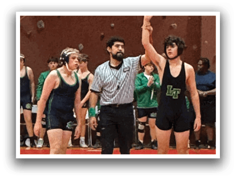 A referee is holding up a hand in a wrestling match, while two wrestlers stand on the mat. AI generated content