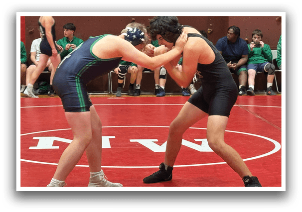 Two wrestlers in uniforms are fighting on a red mat. AI generated content