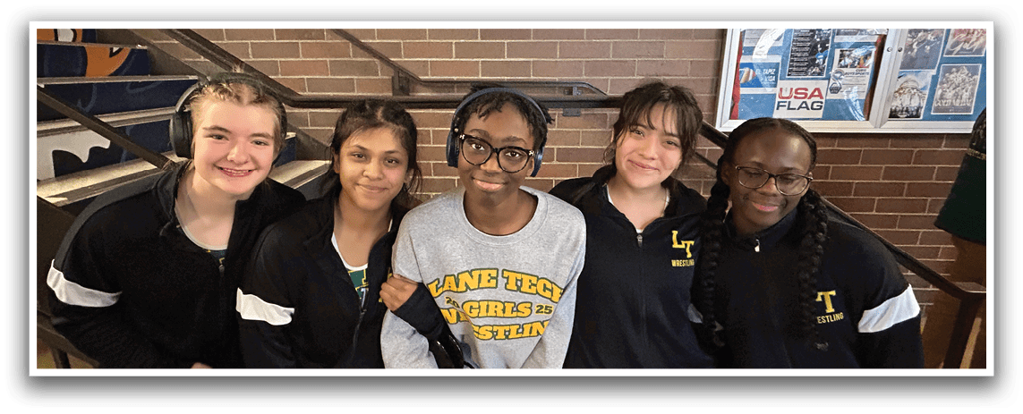 Five girls wearing headphones and black shirts pose for a picture. AI generated content