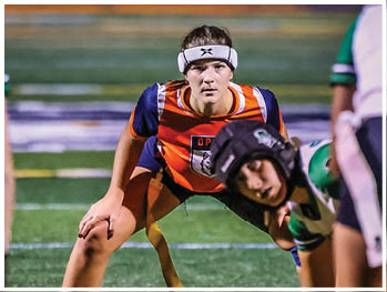 A football player running on the field. Description generated by AI