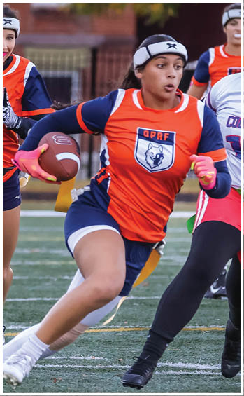 A football player running on the field. Description generated by AI