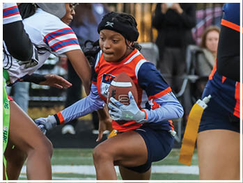 A football player running on the field. Description generated by AI