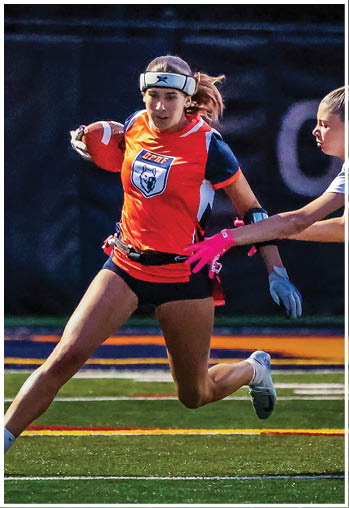 A football player running on the field. Description generated by AI