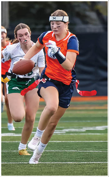 A football player running on the field. Description generated by AI
