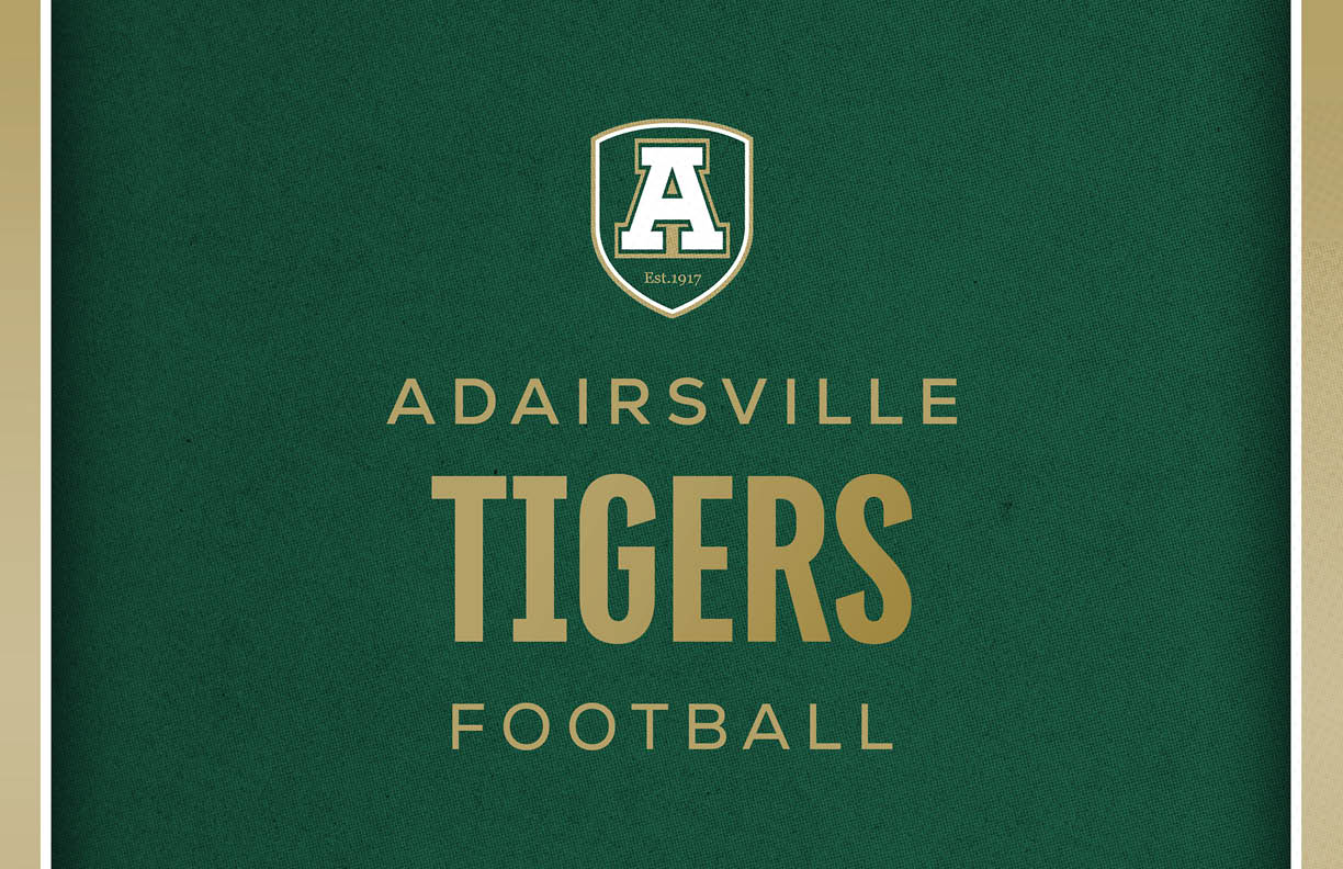 A green background with a shield logo containing the letter A and the text Adairsville Tigers Football in gold letters. Description generated by AI