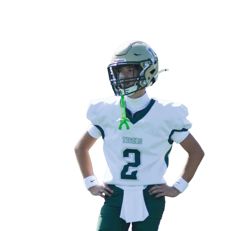 A person wearing a football uniform with a helmet and the number two on the jersey stands with hands on hips. Description generated by AI