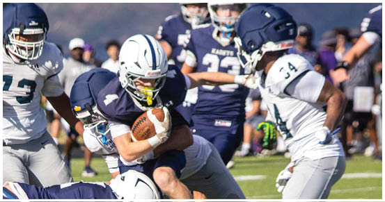 A football player is sliding on the ground. Description generated by AI