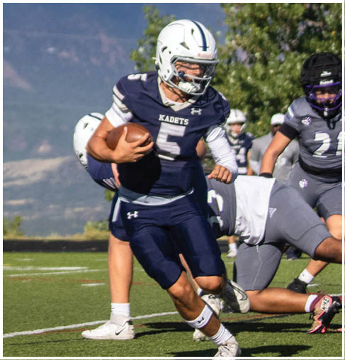 A football player running on the field. Description generated by AI
