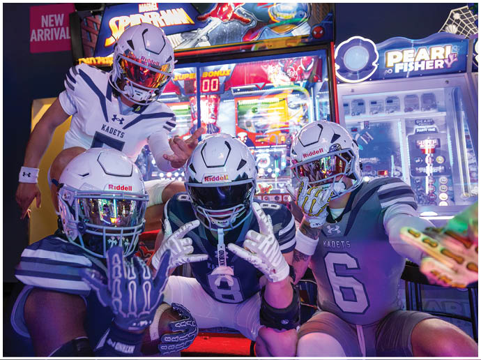 A football player wearing a blue and white uniform. Description generated by AI