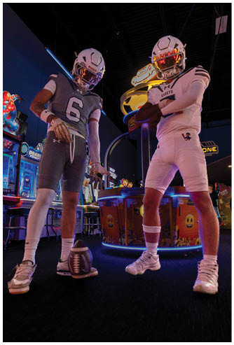 A football game is being played on a field. Description generated by AI