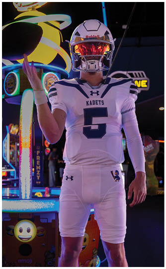A football player catching a ball. Description generated by AI