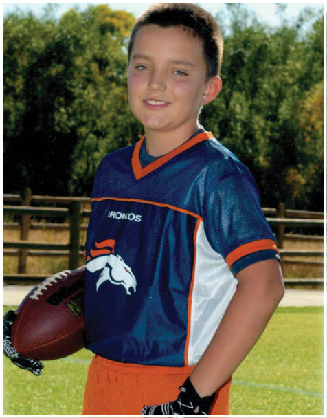 A football player wearing a blue and red jersey. Description generated by AI