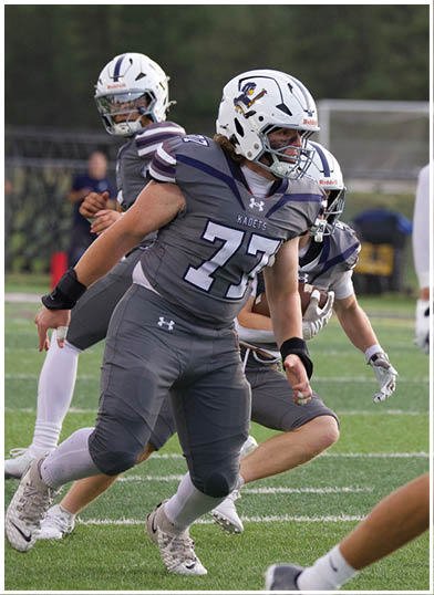 A football player wearing a blue jersey with the number 58 on it. Description generated by AI