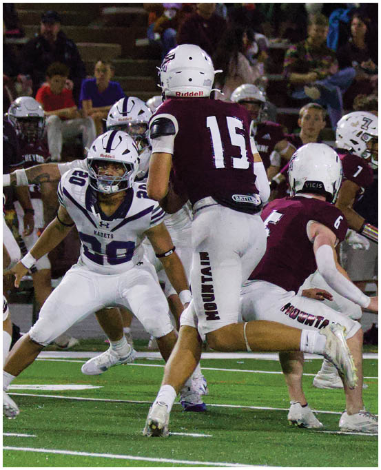 A group of football players wearing black and white uniforms. Description generated by AI