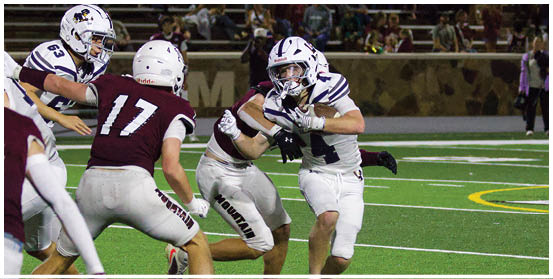 A football player is sliding on the ground. Description generated by AI