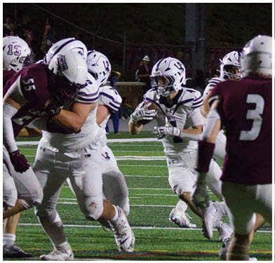A football player running on the field. Description generated by AI