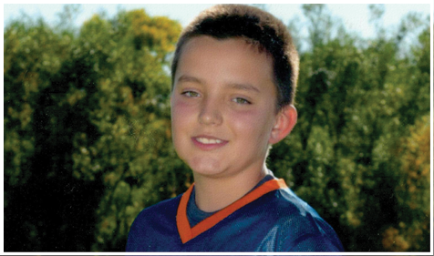 A football player wearing a blue and red jersey. Description generated by AI